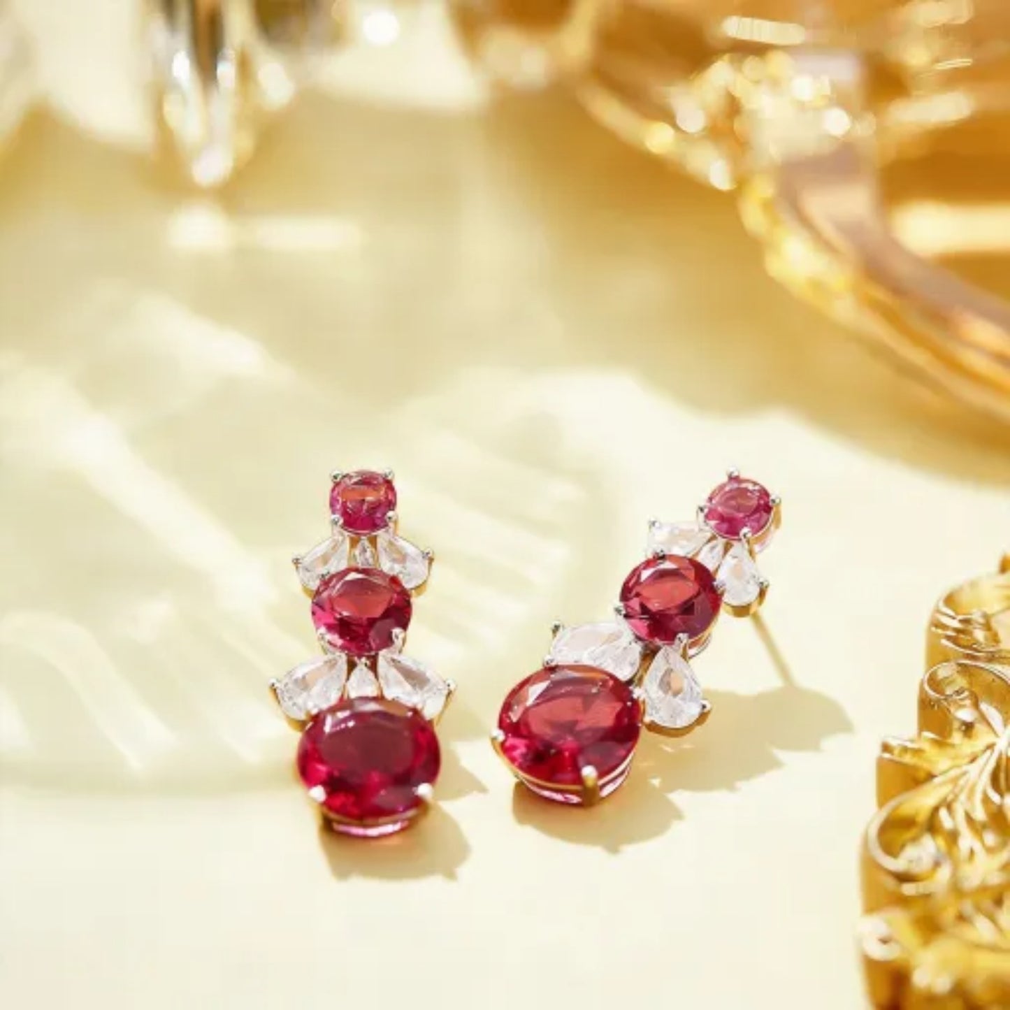 18K gold finish drop earrings with graduated round orbital gemstones