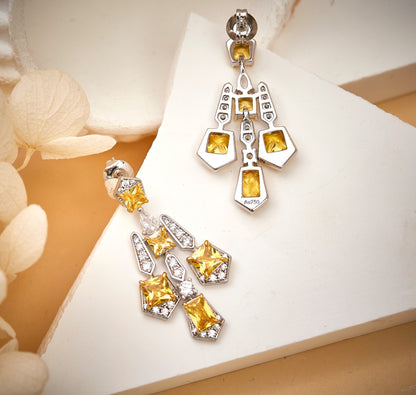 Back view of solar cross drop earrings showing secure closure