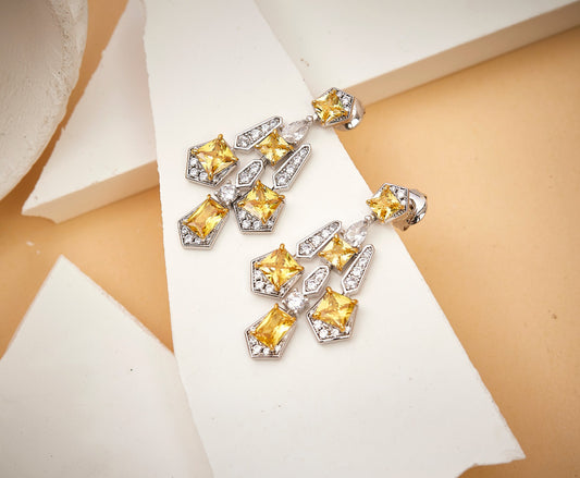 Close-up detail of solar cross drop earrings showing gothic geometric design